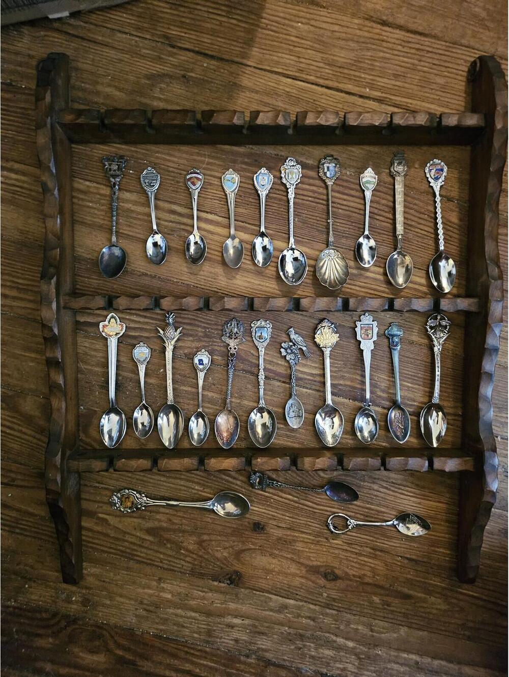 24 vintage souvenir spoons with hand crafted display rack. See pics for types.